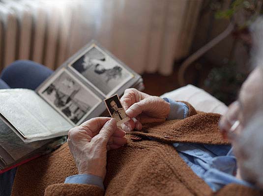 Senior Looking Through Photos